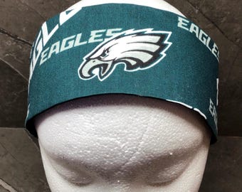 May include: Green and white bandana featuring the Philadelphia Eagles logo and the word "Eagles" written on it.