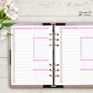 May include: Open planner with pink accents and a rose gold binding. The planner pages are organized with sections for the date, to-do lists, calls/goals, and notes. The top right corner has the text "Dragonfly Love CANADA".