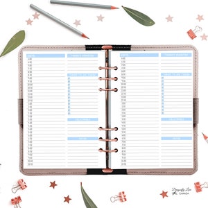 May include: Open planner with daily schedule pages. The pages have blue and white sections for time slots, priorities, and notes. The planner is surrounded by pencils, paper clips, leaves, and star-shaped confetti.