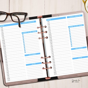 May include: Open planner with a light brown cover, rose gold rings, and lined pages. The planner is open to a daily schedule with blue highlighted sections for priorities, to-dos, calls/goals, and notes. Brown eyeglasses rest on the planner.