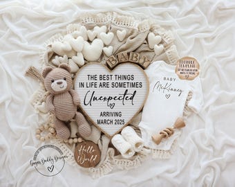 May include: A white babygrow with the text "Baby McKinney" and a heart, a brown crocheted teddy bear, and a wooden letter board with the text "The best things in life are sometimes unexpected, arriving March 2025".
