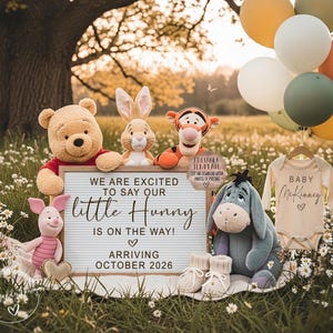 May include: A charming announcement featuring Winnie the Pooh characters, balloons, and a baby onesie. A sign reads "We are excited to say our little Hunny is on the way! Arriving October 2026." The scene is set outdoors with a soft, natural background.