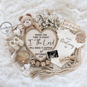 May include: A baby announcement with a heart-shaped sign that reads "When the time is right I. The Lord will make it happen. Isaiah 60:22" with a ultrasound image, a baby onesie that says "Baby McKinney", a teddy bear, and wooden blocks that spell "BABY".