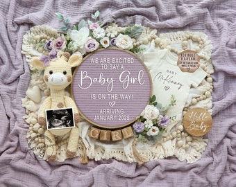 May include: A pink and white letter board with the text "We are excited to say a Baby Girl is on the way! Arriving January 2025". A crocheted giraffe toy sits next to the letter board, holding a sonogram image. A white onesie with the text "Baby McKinney" is on a wooden beaded garland. A wooden sign with the text "Hello Baby" is also on the garland. The background is a purple textured fabric.