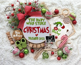May include: A Christmas-themed baby announcement with a round sign that reads "The Baby Who Stole Christmas" with a red heart and the date "December 2025". There are green and red ornaments, a wooden bead garland, a pair of green baby booties, a wooden block that reads "Baby", and a framed ultrasound image.