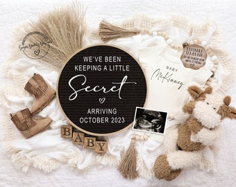 May include: A black letter board with the text "We've been keeping a little secret arriving October 2023".  A white onesie with the text "Baby McKinney" is next to the letter board.  A brown and white stuffed animal, a black and white ultrasound image, and brown cowboy boots are also in the image.