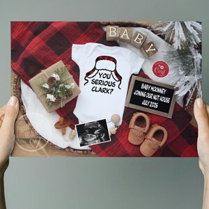 May include: A pregnancy announcement featuring a white onesie with a Santa hat graphic and the text "You Serious Clark?". The announcement includes baby shoes, ultrasound image, and a sign that says "Baby McKinney Joining Our Nut House July 2026".