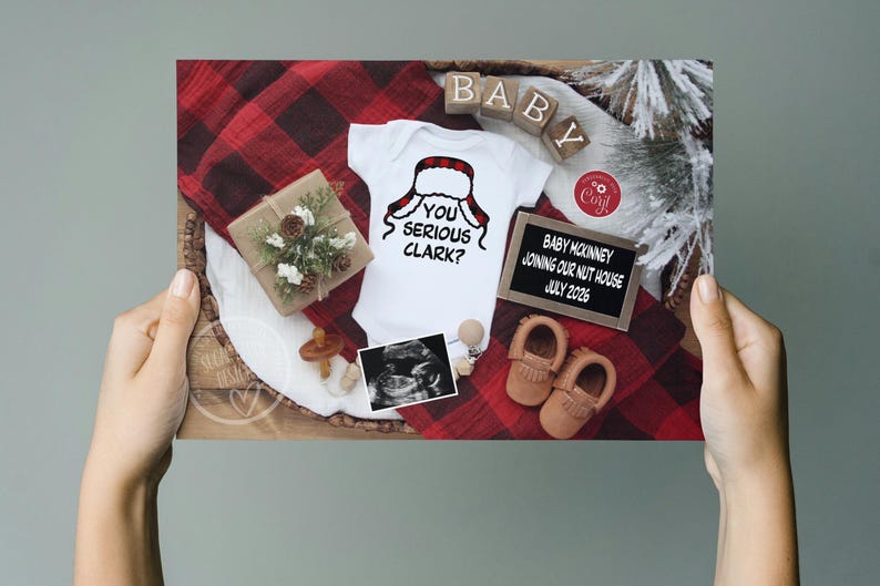 May include: A pregnancy announcement featuring a white onesie with a Santa hat graphic and the text "You Serious Clark?". The announcement includes baby shoes, ultrasound image, and a sign that says "Baby McKinney Joining Our Nut House July 2026".