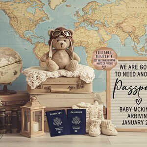 May include: A travel-themed baby announcement with a world map backdrop. A teddy bear wearing aviator goggles sits atop vintage suitcases. The announcement includes the text "We are going to need another Passport" and baby's arrival date.
