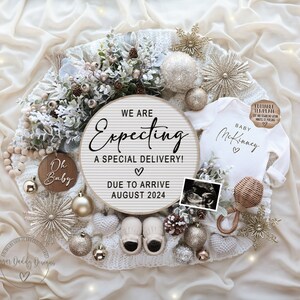 May include: A white baby onesie with the text "Baby McKinney" and two hearts. The onesie is surrounded by a white knitted blanket, a wooden sign that says "We are Expecting a Special Delivery! Due to Arrive August 2024", a wooden ornament that says "Oh Baby", a small wooden rattle, a baby bootie, a gold star, and a gold ornament. The background is a white and gold fabric.