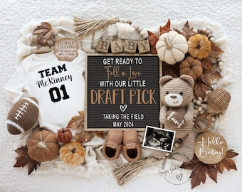 May include: Fall-themed baby announcement with a white onesie that says "Team McKinney 01", a brown crocheted teddy bear holding a football, a letter board that says "Get ready to Fall in Love with our little Draft Pick Taking the Field May 2024", and a wooden sign that says "Hello Baby!"