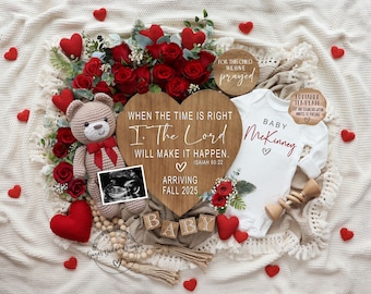 May include: A wooden heart-shaped sign with the text "When the time is right, I, The Lord will make it happen. Isaiah 60:22" and the words "Arriving Fall 2025". A teddy bear with a red bow, a baby onesie with the text "Baby McKinney", and a red heart-shaped pillow are also in the image.