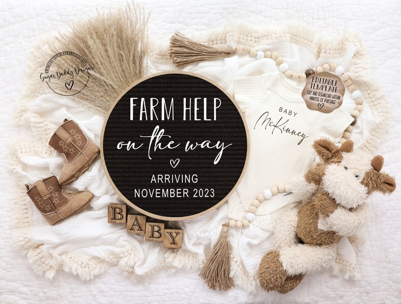 May include: A black and white letter board with the text "FARM HELP on the way" and "ARRIVING NOVEMBER 2023". A white onesie with the text "BABY McKinney" is next to the letter board. There are brown cowboy boots, wooden blocks that spell "BABY", and a stuffed cow toy.