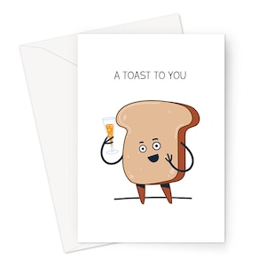 May include: A greeting card with a cartoon illustration of a slice of bread holding a glass of champagne. The text "A TOAST TO YOU" is printed above the illustration.