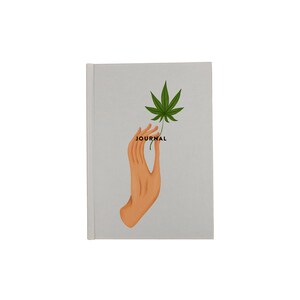 May include: A grey journal with a hand holding a green marijuana leaf and the word "JOURNAL" printed on the cover.