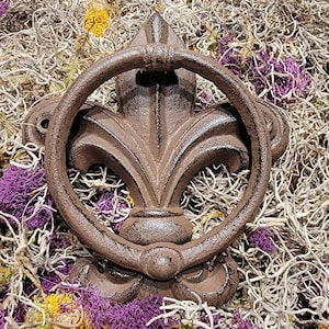 Golpeador de puerta Fleur de lis de hierro fundido