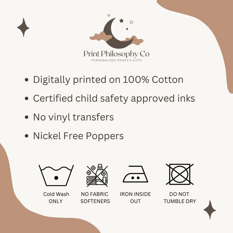 May include: A white graphic with black text and icons outlining the care instructions for a 100% cotton product. The text reads "Digitally printed on 100% Cotton", "Certified child safety approved inks", "No vinyl transfers", and "Nickel Free Poppers". The icons show a washing machine with a cold water setting, a crossed-out bottle of fabric softener, an iron with a dot inside, and a crossed-out circle.