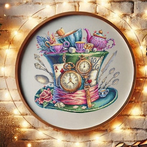 May include: A framed cross-stitch featuring a whimsical design of a Mad Hatter's hat. The hat is adorned with teacups, a teapot, pocket watches, and playing cards. The color palette includes shades of blue, pink, green, and gold.