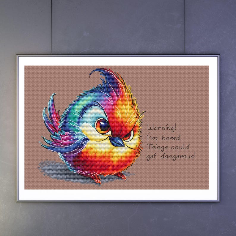 May include: A colorful cartoon bird with a red, orange, yellow, blue, and purple color scheme. The bird has a grumpy expression and is saying "Warning! I'm bored. Things could get dangerous!"
