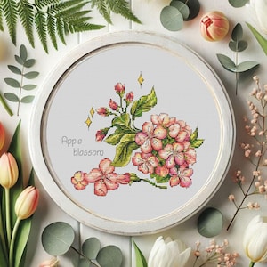 Lentebloemen kruissteekpatroon met appelbloesem en roze bloemen. Appelbloeigrafiek. Bloemen x-steekborduurwerk. Digitaal patroon.