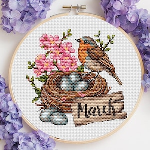 May include: A set of three ceramic mugs with a speckled, matte finish. The mugs are in shades of cream, light gray, and dark gray. Each mug has a simple, minimalist design, perfect for coffee or tea.