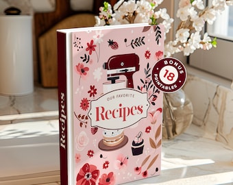 Peut inclure: Un classeur de recettes rose et blanc avec un motif floral et un onglet rouge qui dit "Recettes". Le classeur a un autocollant rouge avec le texte "Bonus 18 Printables".