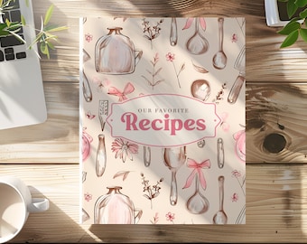 May include: A beige cookbook cover with a pink and brown floral pattern. The cover features a title that reads "Our Favorite Recipes" in a pink, cursive font.