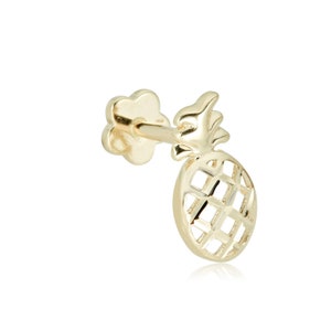 May include: Gold pineapple stud earring with a delicate, openwork design. The earring features a small, flower-shaped post.