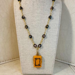 Double Serpent Vintage Mahjong tile on a chain of Cloisonne spheres, gold plated wheels and etched links.