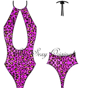 May include: A pink and gold leopard print swimsuit with a halter neck and a high leg cut. The swimsuit has a keyhole opening in the front and a tie at the back.