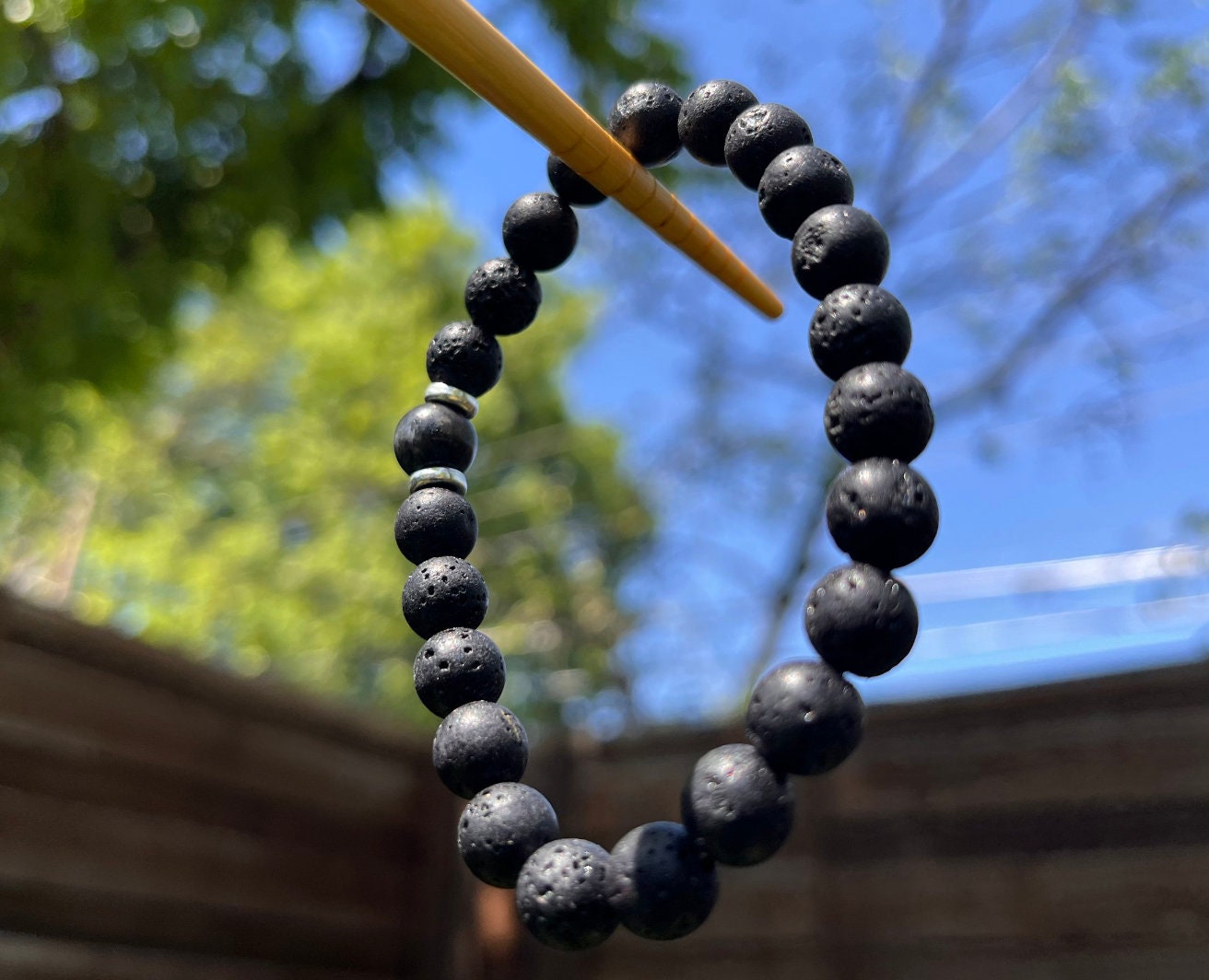 Lavasteen armband met Boeddha en 7 chakra