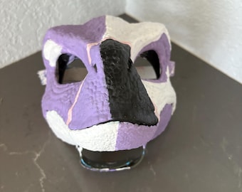 Purple painted raptor mask