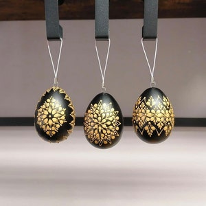 Black and gold goose-egg Easter eggs with wax patterns, for hanging, 9-10 cm