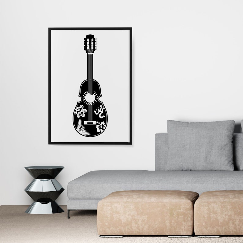 May include: Black and white illustration of a guitar with intricate designs on the body. The guitar is framed and hanging on a white wall above a gray couch.