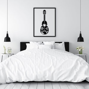 May include: A black and white illustration of a guitar with intricate designs on the body. The guitar is hanging on a white wall above a white bed with black bedding.