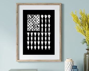 May include: A black and white print of an American flag with arrowheads in place of the stars. The arrowheads are white and the flag is distressed.