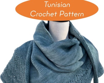 May include: A teal blue Tunisian crochet shawl with a lacy pattern. The shawl is draped over a white mannequin.
