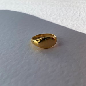 Gold signet oval ring. Stainless steel band costume stacking layering