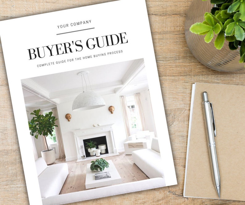 May include: A white and gray home buyer's guide with the text "Buyer's Guide" in black and the text "Complete Guide for the Home Buying Process" in smaller black text. The cover features a photo of a white living room with a fireplace, a white sofa, and a large white pendant light.