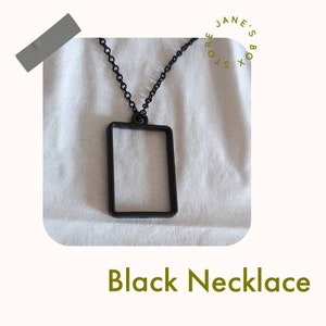 Black rectangle box necklace.