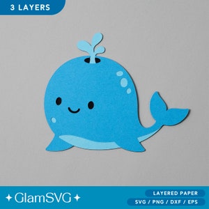 Puede incluir: Una manualidad de papel en capas de una ballena azul con una cara feliz y un chorro de agua en la parte superior. La ballena está diseñada para la elaboración de papel e incluye 3 capas. El texto "3 LAYERS" está en la parte superior de la imagen. El texto "GlamSVG" está en la parte inferior de la imagen.