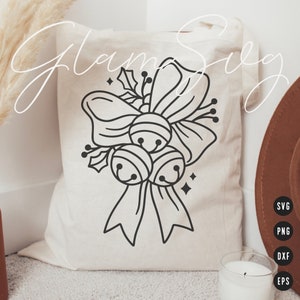 May include: A black and white line art design of a Christmas bow with three bells and holly leaves on a white tote bag. The bag is made of canvas and has a drawstring closure.