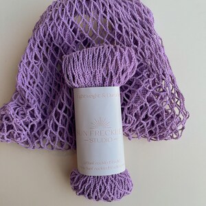 May include: A lavender crocheted mesh bag with a label that reads "Lightweight & Durable" and "Sun Freckled Studio".