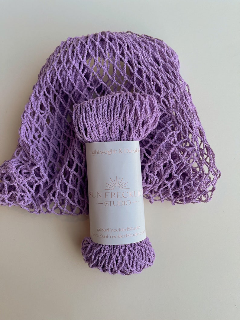 May include: A lavender crocheted mesh bag with a label that reads "Lightweight & Durable" and "Sun Freckled Studio".