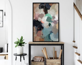 Könnte beinhalten: Abstrakter Kunstdruck mit schwarzem Rahmen, der ein farbenfrohes abstraktes Design in Braun-, Rosa-, Blau-, Grün- und Schwarztönen zeigt. Der Druck wird auf einem Holzregal mit schwarzem Metallrahmen präsentiert.