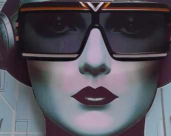 May include: Rectangular black sunglasses with a thick frame and a prominent gold-toned V-shaped emblem at the bridge. The lenses are dark and tinted, featuring a sleek, flat-top design with gold-toned horizontal accents along the upper and lower rims.