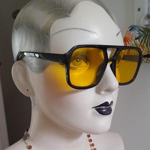 Classic retro black frame square sunglasses with vivid yellow lenses ibiza poolside party festival shades punk pop fashion sunglasses