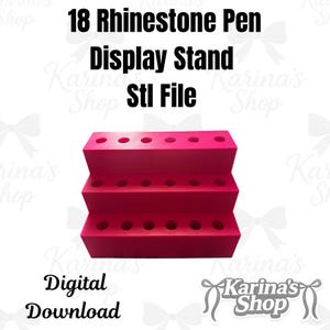 May include: A bright pink, three-tiered display stand for 18 rhinestone pens. The stand has multiple holes for holding pens and the text "18 Rhinestone Pen Display Stand Stl File" is at the top. The words "Digital Download" are at the bottom.