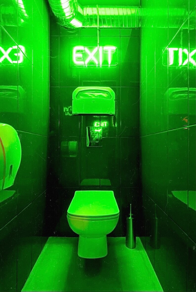 May include: A green bathroom with a toilet, a toilet paper dispenser, and a neon sign that says "EXIT".