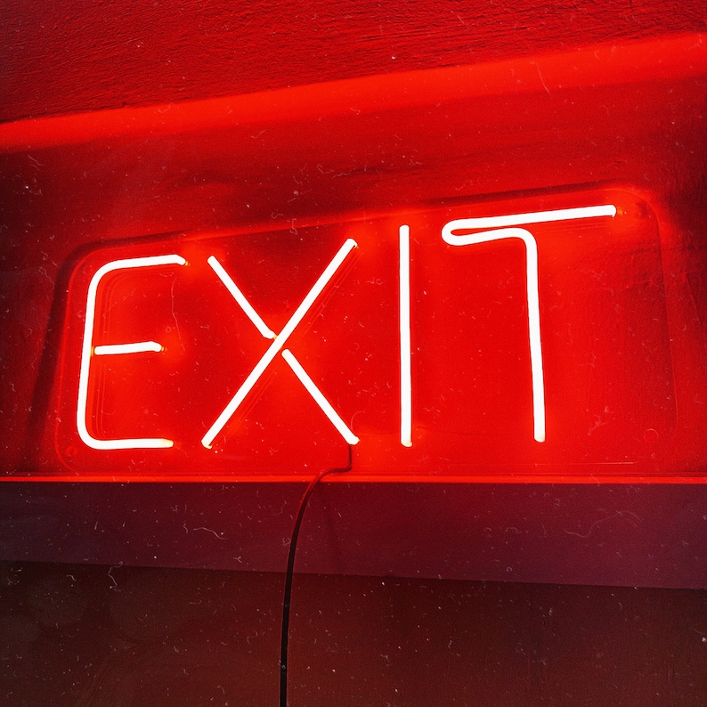 May include: A red neon sign with the word "EXIT" in white neon lettering.